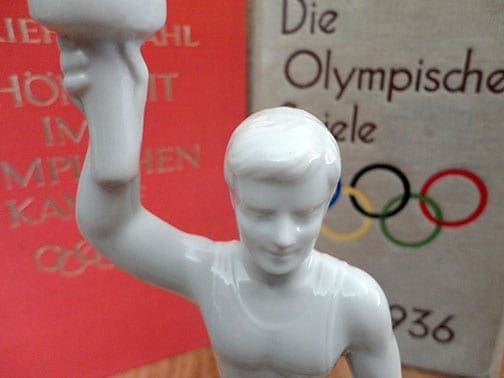 OLYMPIC GAMES PORCELAIN TORCH-BEARER STATUE